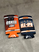 Two beer can coolers, one orange and one navy, with 'Oskee Light' and 'ILL-IPA' branding on a gray surface.