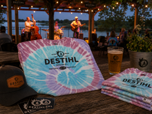 DESTIHL Brewery Tye-Dye shirt on table at outdoor stage