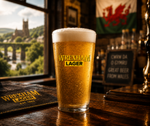 Wrexham Lager Pint Glass on a pub bartop